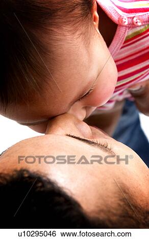 Stock Photograph - African American father holding daughter. Fotosearch