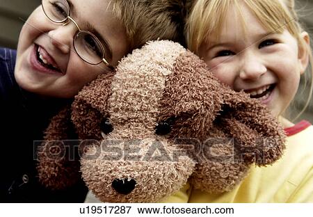 Stock Photo - Boy and girl laughing together. Fotosearch