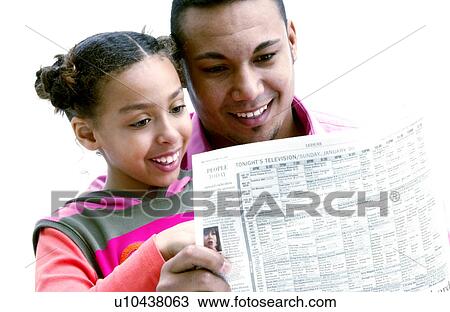Father and daughter reading newspaper View Large Photo Image Stock Image - Father and daughter reading newspaper. Fotosearch