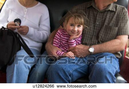Stock Photograph - Girl with grandparents. Fotosearch