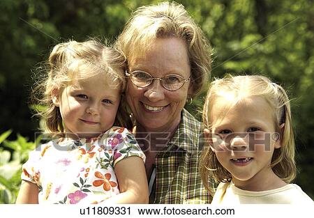 Stock Image - Grandma with grandchildren. Fotosearch