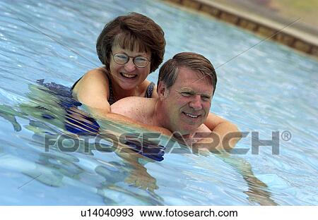 Senior couple swimming View Large Photo Image Stock Image - Senior couple swimming. Fotosearch