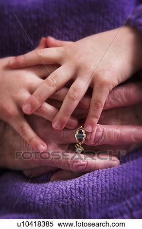 Senior woman holding childs hand View Large Photo Image Stock Photography - Senior woman holding childs hand. Fotosearch