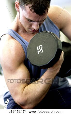 Man lifting weights View Large Photo Image Picture - Man lifting weights. Fotosearch