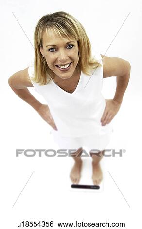 Woman on scale View Large Photo Image Stock Photograph - Woman on scale. Fotosearch