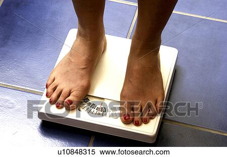 Woman on scale View Large Photo Image Stock Photography - Woman on scale. Fotosearch