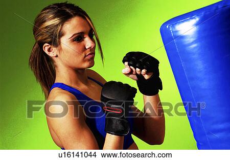 Picture - Woman practicing boxing. Fotosearch