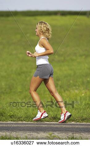 Woman running View Large Photo Image Stock Photo - Woman running. Fotosearch