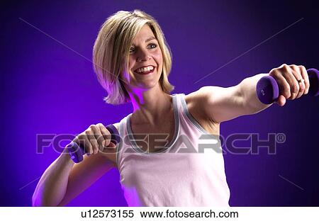 Stock Photography - Woman with weights. Fotosearch