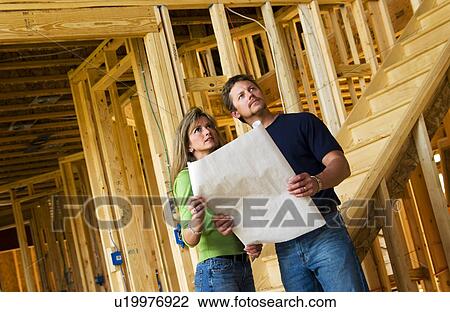 Couple building home View Large Photo Image Stock Image - Couple building home. Fotosearch