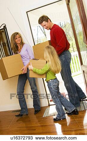 Family moving into new home View Large Photo Image Stock Image - Family moving into new home. Fotosearch