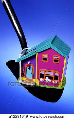 House on shovel View Large Photo Image Stock Photo - House on shovel. Fotosearch
