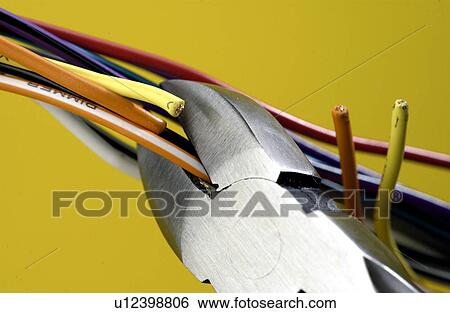 Wire clippers cutting wires View Large Photo Image Stock Photograph - Wire clippers cutting wires. Fotosearch
