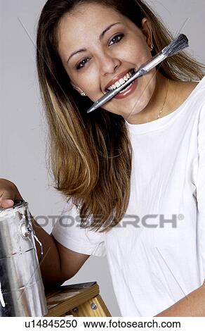 Stock Image - Woman painting. Fotosearch