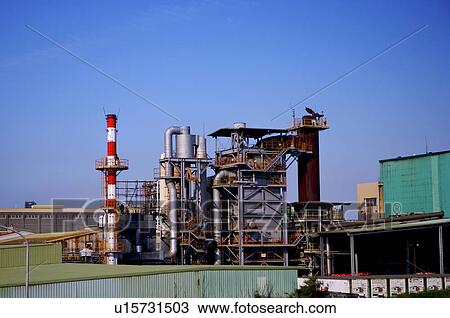 A factory's industrial equipment, consisting of chimney and large pipes View Large Photo Image Stock Image - A factory's industrial equipment, consisting of chimney and large pipes. Fotosearch
