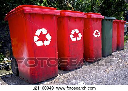 Stock Photo - A row of garbage and recycling bins with wheels. Fotosearch