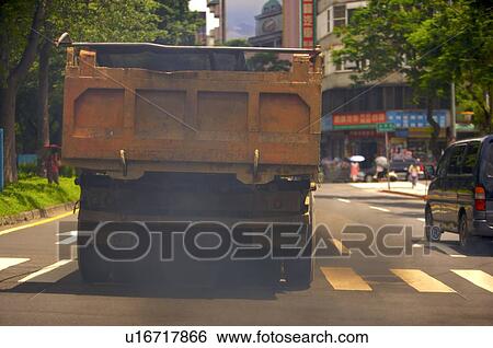 Back of a yellow truck letting out black smoke View Large Photo Image Stock Photograph - Back of a yellow truck letting out black smoke. Fotosearch