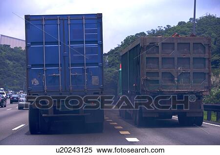 Back of two trucks on the road, both letting out black smoke View Large Photo Image Stock Photography - Back of two trucks on the road, both letting out black smoke. Fotosearch