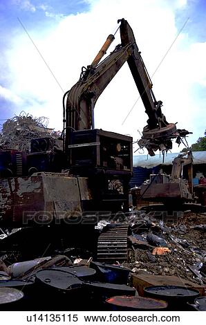 Excavators in a junkyard View Large Photo Image Stock Photography - Excavators in a junkyard. Fotosearch