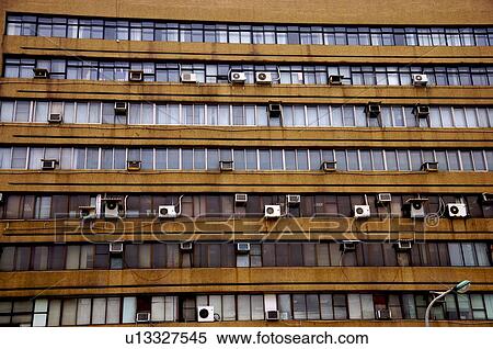 Factory exterior with dirty windows, and air-conditioners on the outside View Large Photo Image Stock Photography - Factory exterior with dirty windows, and air-conditioners on the outside. Fotosearch