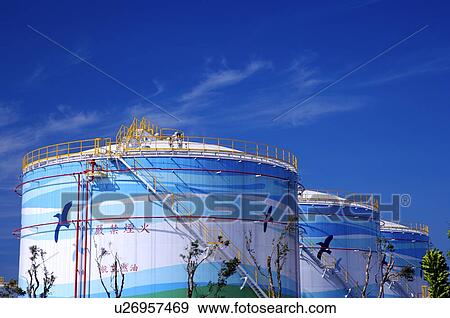 Stock Photo - Large fuel storage tanks, in a row. Fotosearch
