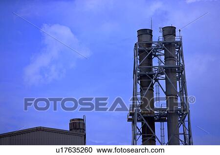 Large industrial chimneys View Large Photo Image Stock Image - Large industrial chimneys. Fotosearch
