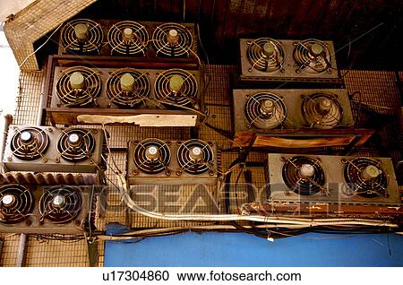 Stock Image - Old electric fans, side by side. Fotosearch