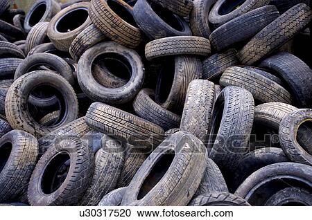 Old tires in a junkyard, full frame View Large Photo Image Stock Image - Old tires in a junkyard, full frame. Fotosearch