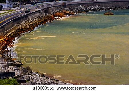 Stock Photography - Polluted waters next to a road. Fotosearch