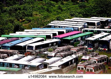 Picture - Run-down automobiles in rows, in a junkyard. Fotosearch