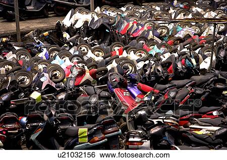 Run-down motorcycles in rows and stacks, in a junkyard View Large Photo Image Stock Photograph - Run-down motorcycles in rows and stacks, in a junkyard. Fotosearch
