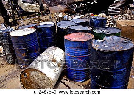 Run-down oil drums and garbage in a junkyard View Large Photo Image Stock Photo - Run-down oil drums and garbage in a junkyard. Fotosearch