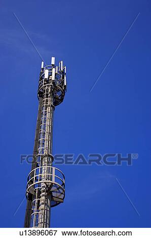 Stock Photo - Tall metallic factory tower. Fotosearch