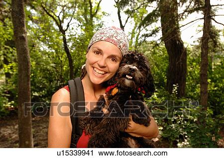 Woman hiker with dog in woods, Regina, Saskatchewan View Large Photo Image Stock Image - Woman hiker with dog in woods, Regina, Saskatchewan. Fotosearch