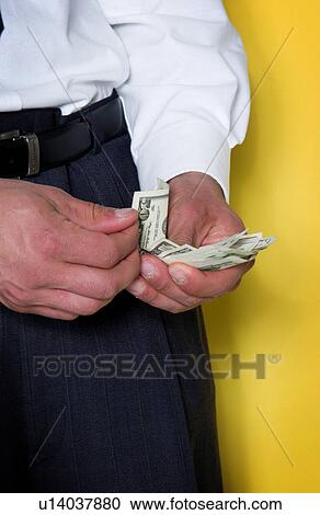 Businessman counting money View Large Photo Image Stock Image - Businessman counting money. Fotosearch