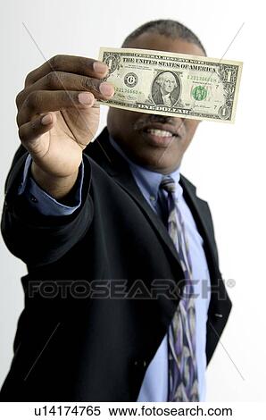 Stock Photography - Businessman holding money. Fotosearch
