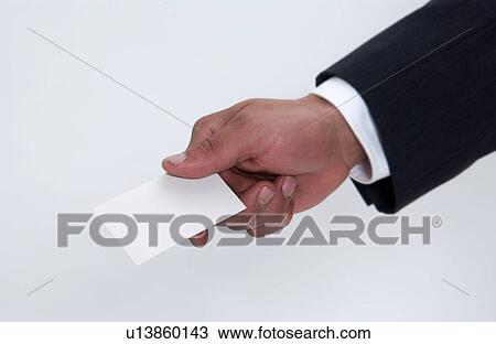 Stock Image - Businessman holding out card. Fotosearch