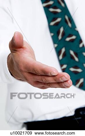 Businessman holding out hand to shake hands View Large Photo Image Stock Photo - Businessman holding out hand to shake hands. Fotosearch