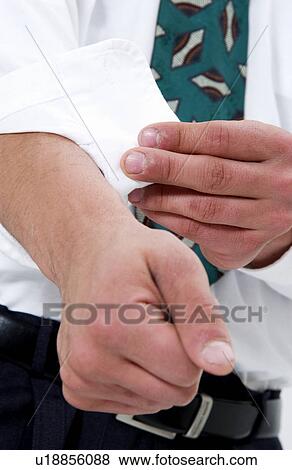Stock Photo - Businessman rolling up his sleeves. Fotosearch