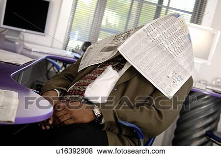 Stock Photo - Businessman with newspaper over his head. Fotosearch