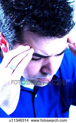 Picture - Man with headache. Fotosearch