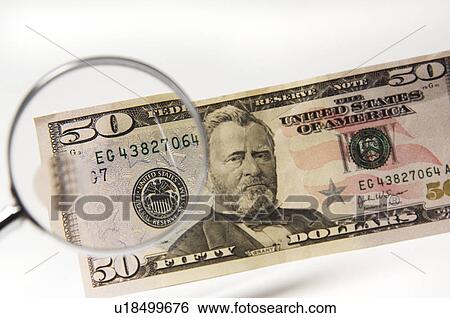 Money under a magnifying glass View Large Photo Image Stock Photograph - Money under a magnifying glass. Fotosearch