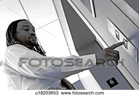 African American businessman pushing elevator button View Large Photo Image Stock Image - African American businessman pushing elevator button. Fotosearch