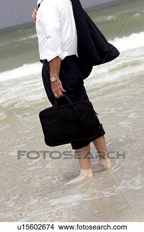Picture - Businessman at the beach. Fotosearch