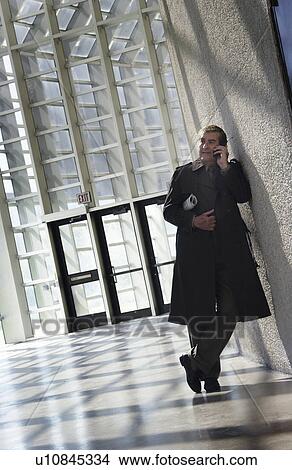 Picture - Businessman on cell phone. Fotosearch