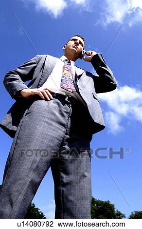 Businessman talking on cell phone View Large Photo Image Stock Image - Businessman talking on cell phone. Fotosearch