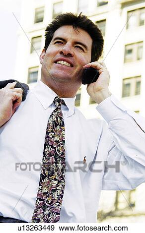 Businessman talking on cell phone View Large Photo Image Stock Photo - Businessman talking on cell phone. Fotosearch
