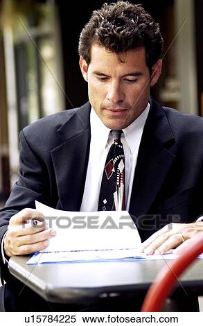 Stock Photography - Businessman working outside. Fotosearch