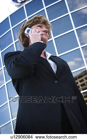 Businesswoman on cell phone View Large Photo Image Picture - Businesswoman on cell phone. Fotosearch