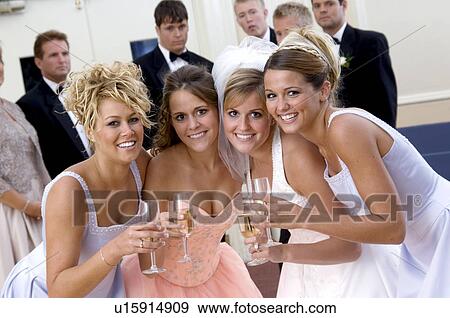 Stock Photo - Bride and bridesmaids. Fotosearch